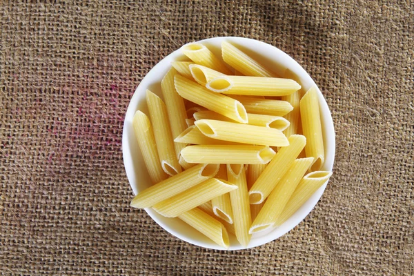 Pasta on sack cloth — Stock Photo, Image