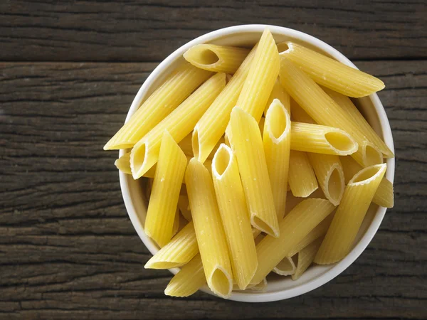 Dry pasta on table — Stock Photo, Image