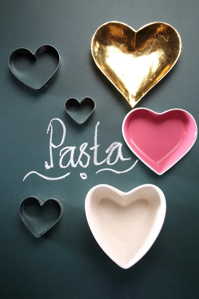 Heart shape containers with pasta lettering — Stock Photo, Image
