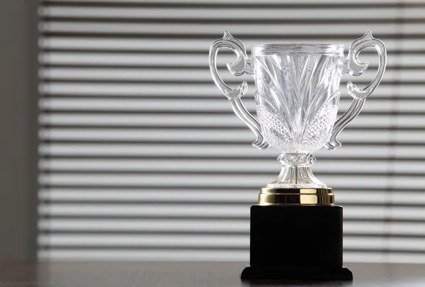 Glass trophy on the table top — Stock Photo, Image