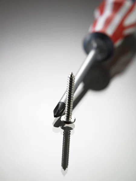 Screw and screwdriver — Stock Photo, Image