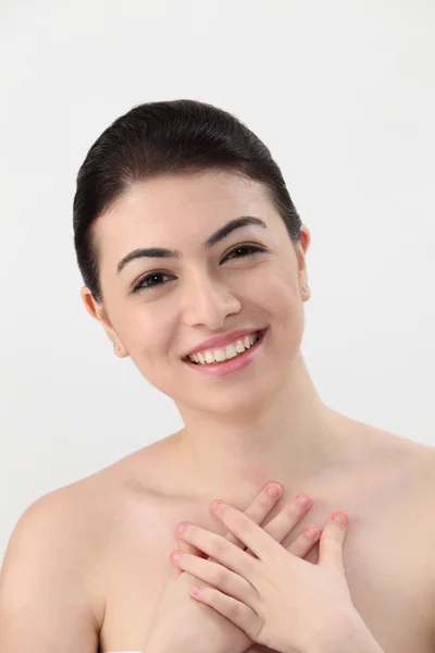 Woman touching her chest — Stock Photo, Image