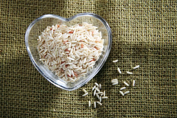 Brown rice in the bowl — Stock Photo, Image