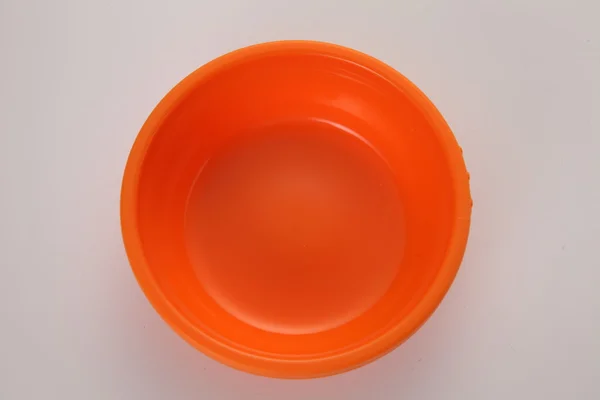 Orange plastic bowl — Stock Photo, Image