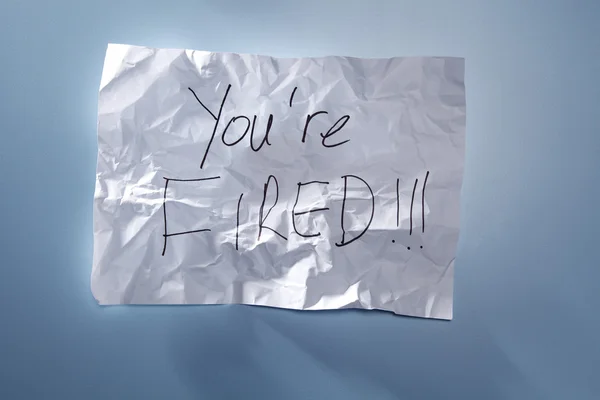 You're Fired text on Crumpled paper — 图库照片
