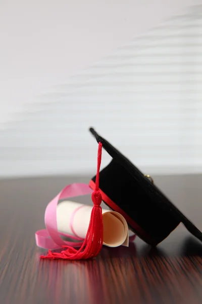 Mortar board on table — Stock Photo, Image