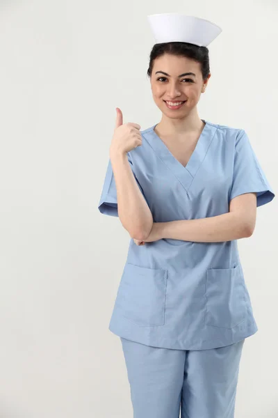 Enfermeira com os polegares para cima — Fotografia de Stock
