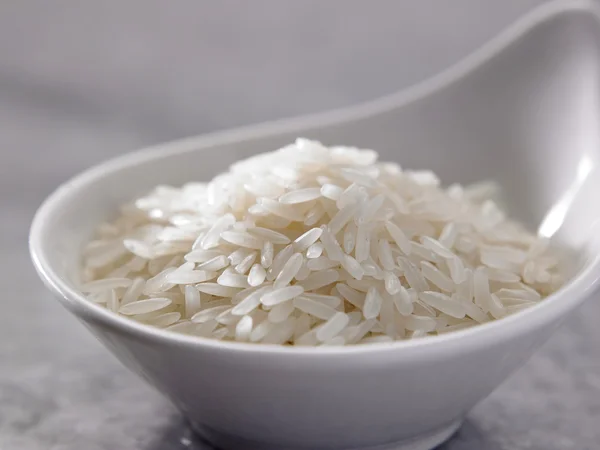 Bowl of uncook white rice — Stock Photo, Image