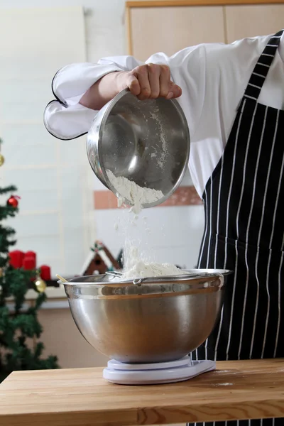 Pouring the caster sugar in the mixer — Stock Photo, Image