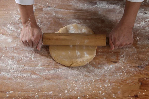 Hand with rolling pin and flour — Stock Photo, Image