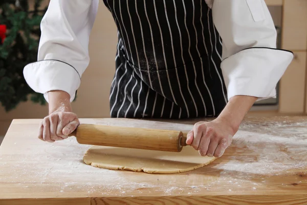 Hand with rolling pin and flour — Stock Photo, Image