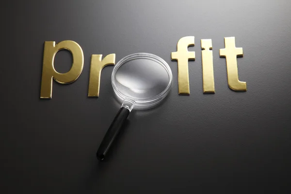 Word profit with magnifying glass — Stock Photo, Image