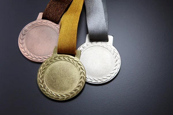 Zlaté, stříbrné a bronzové medaile — Stock fotografie