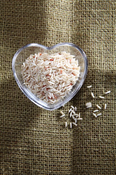 Brown rice in the bowl — Stock Photo, Image