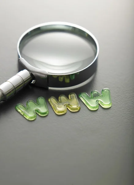 Alphabet www beside of magnifying glass — Stock Photo, Image