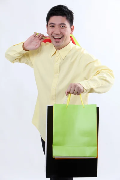 Homem com sacos de compras — Fotografia de Stock