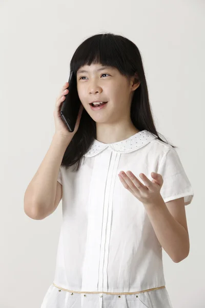 Menina chinesa no telefone — Fotografia de Stock