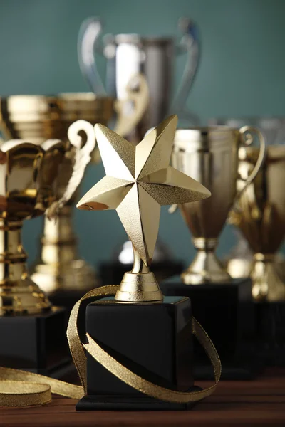 Group of the trophies on the green background — Stock Photo, Image