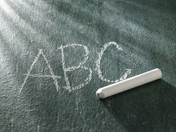 Alphabet on the black board — Stock Photo, Image