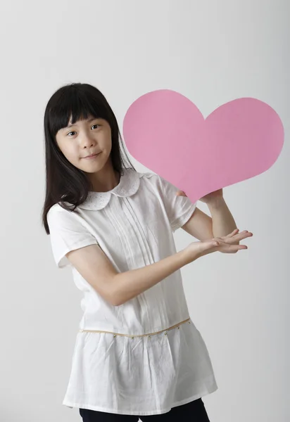 Girl with heart shape — Stock Photo, Image