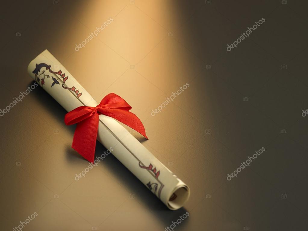 Urkunde mit roter Schleife Stockfotografie lizenzfreie Fotos