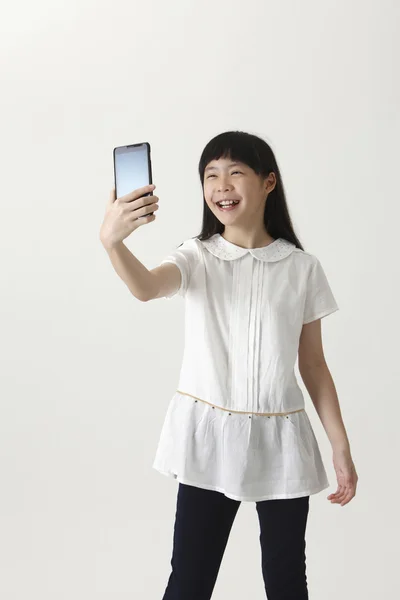 Chinese girl making selfie — Stock Photo, Image