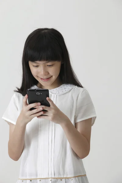 Chinese girl on the phone — Stock Photo, Image