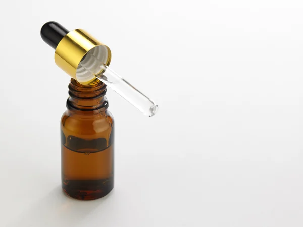 The bottle of the essential oil — Stock Photo, Image