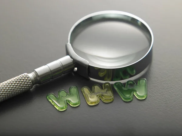 Alphabet www beside of magnifying glass — Stock Photo, Image