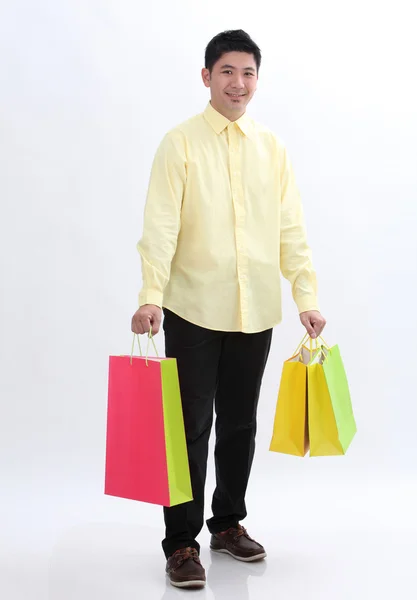 Hombre con bolsas de compras —  Fotos de Stock