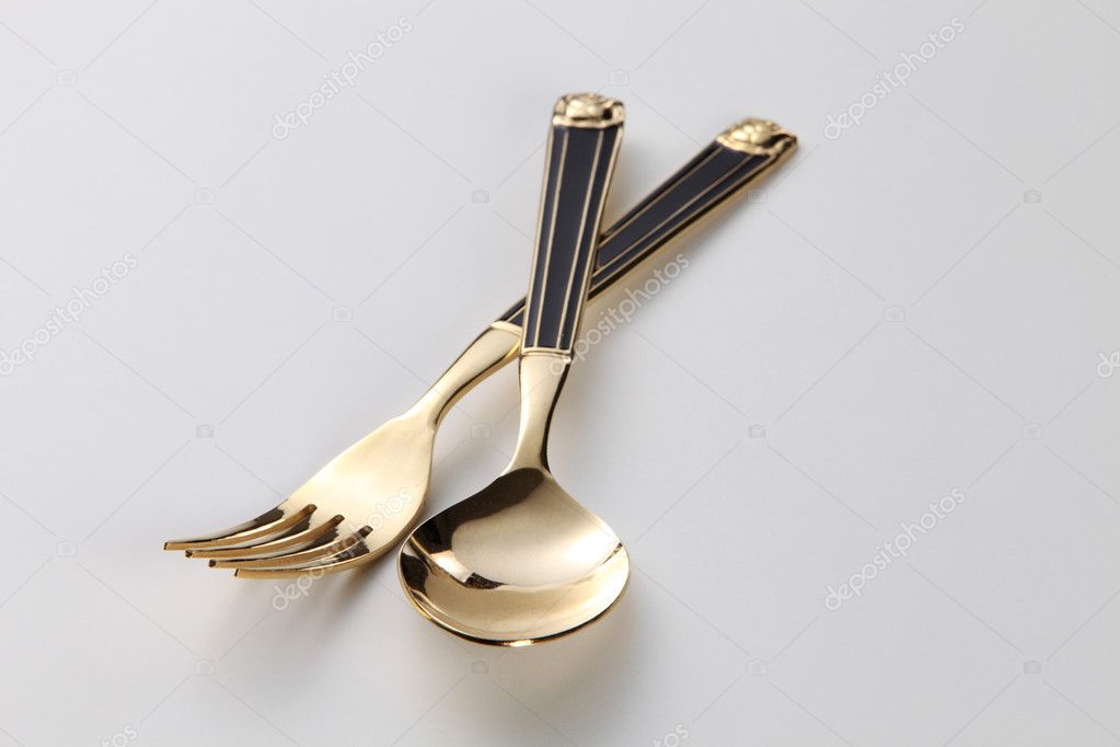 Löffel Und Gabel In Einem Gabel und Löffel auf einem weißen - Stockfotografie: lizenzfreie Fotos