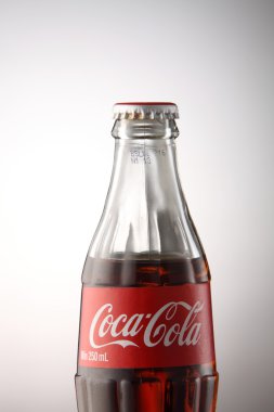A bottle of Coca Cola drinks