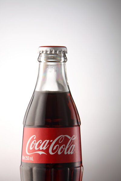 A bottle of Coca Cola drinks
