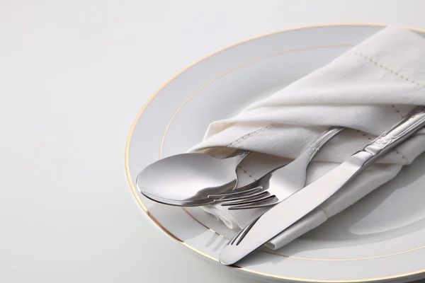 Folded napkin with utensils — Stock Photo, Image