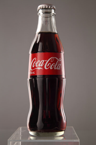 A bottle of Coca Cola drinks