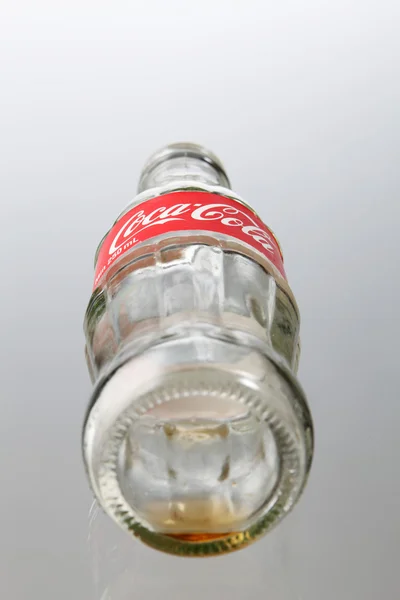 Empty bottle of coca cola — Stockfoto