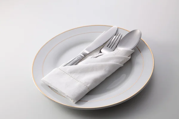 Folded napkin with utensils — Stock Photo, Image