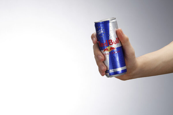 hand holding redbull