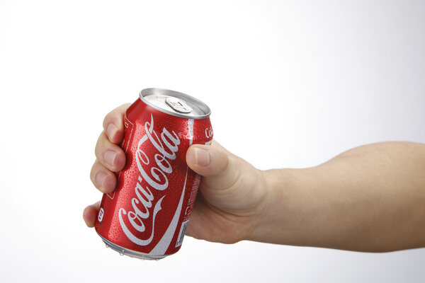 hand holding coca cola