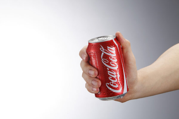 hand holding coca cola