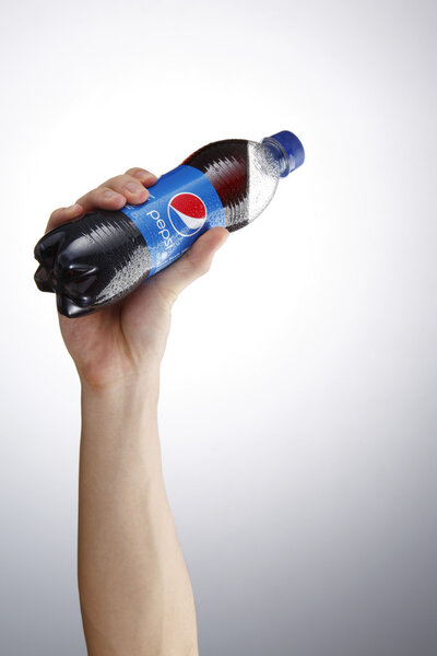Hand holding Pepsi