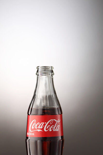 A bottle of Coca Cola drinks