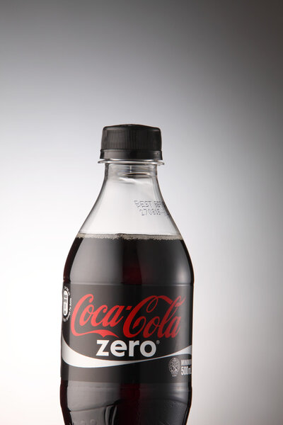 A bottle of Coca Cola drinks