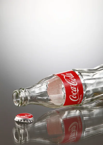 Empty coca cola bottle — Stock Photo, Image