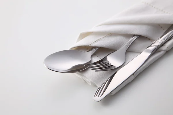 Folded napkin with utensils — Stock Photo, Image