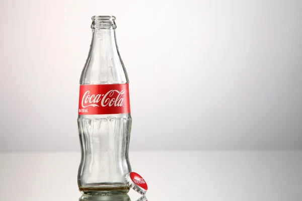 Empty coca cola bottle — Stock Photo, Image