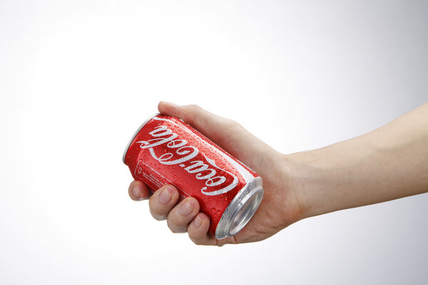 hand holding coca cola