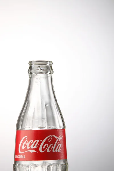 Empty coca cola bottle — Stock Photo, Image