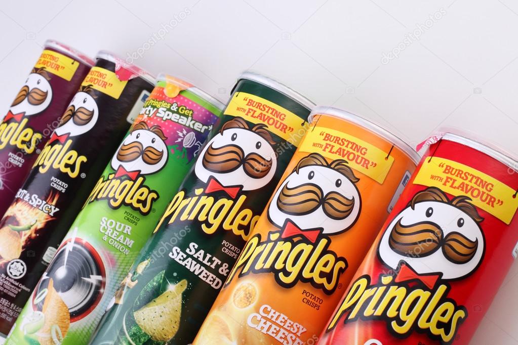 KUALA LUMPUR, MALAYSIA,  MAY 14, 2015:  Pringles chips packages  on white background. Owned by the Kellogg Company, Pringles is a brand of potato snack chips sold in 140 countries