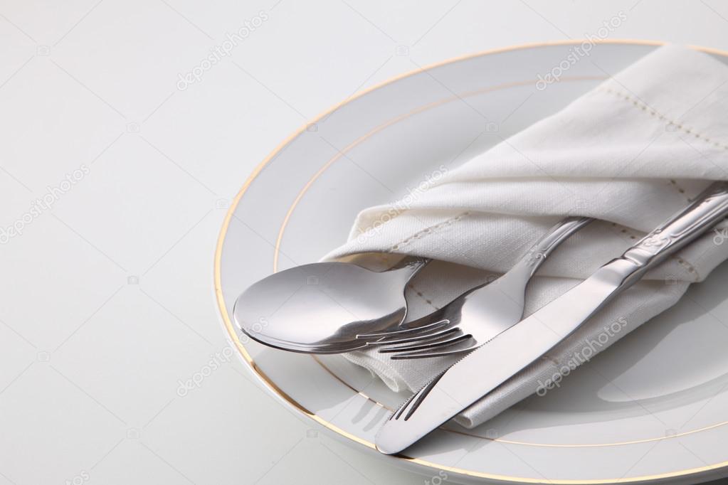 folded napkin with utensils
